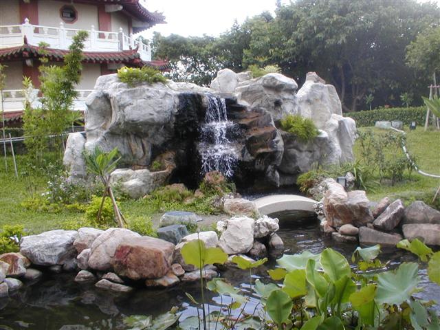 Fish pond and fountain in the gardens of Ba Gua Shan